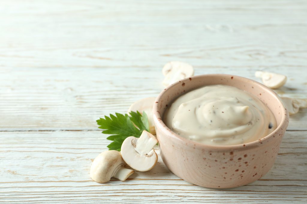 Jar of Texas Best Smokehouse Portobello Mushroom Sauce with creamy texture and rich mushroom flavour