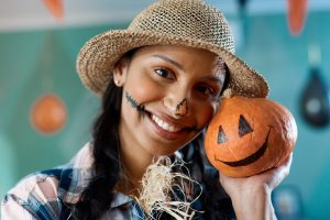 Image of Halloween Par-Tee at PGA Frisco with families dressed in costumes and enjoying golf activities.