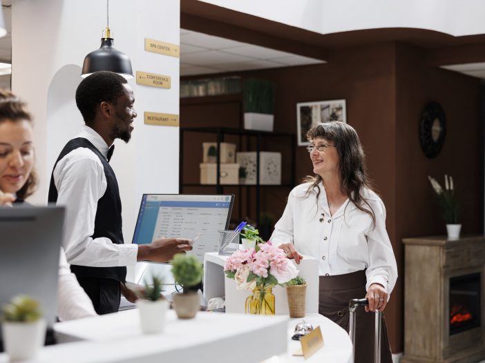 Traveler making a phone call to check hotel hold status