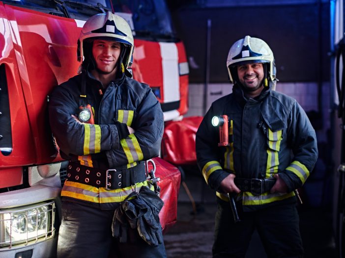 Firefighters monitoring safety at a large outdoor music event