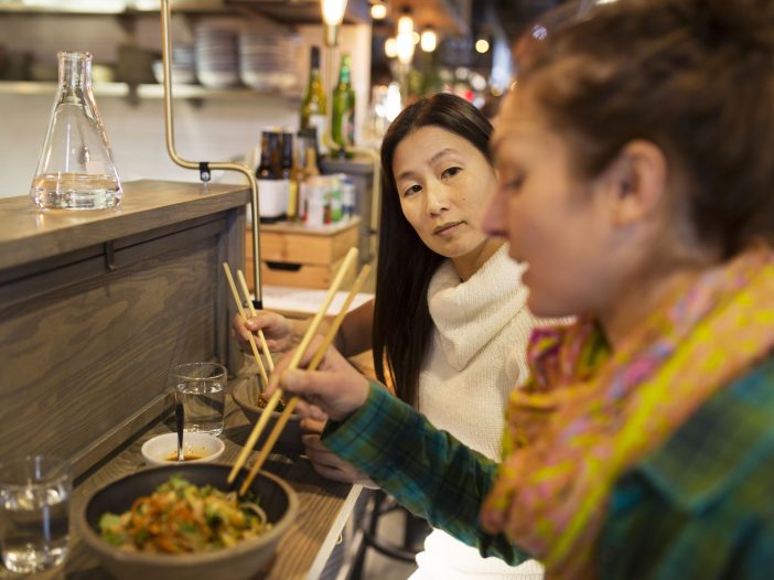 A colorful assortment of Chinese food dishes, including dumplings, fried rice, and stir-fried noodles, served at a popular restaurant in Omaha.